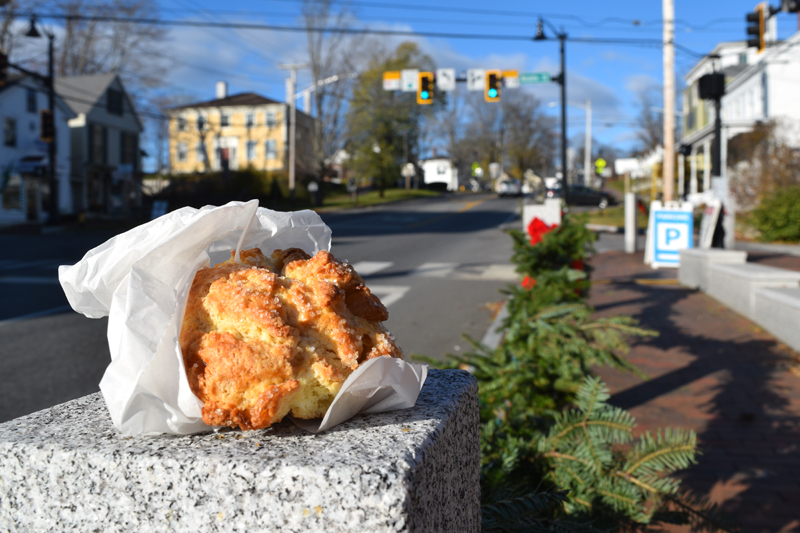 A peach and ginger scone perched on a fence post across from Treats in Wiscasset. The bakery's scones are famous among locals, and owner Stacy Linehan and her staff frequently change the variety based on the season and their ingredients. (Nate Poole photo)
