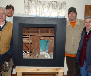 McClure "Mac," Darryl, Justin, and Richard "Dick" Day with Jake Day's barn diorama, which was installed in the Day ancestral home in Damariscotta. (Paula Roberts photo, LCN file)