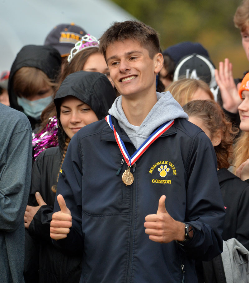 Medomak Valley senior Connor Daigle gives two thumbs up after being presented with his State Class B Championship medallion. (Paula Roberts photo)