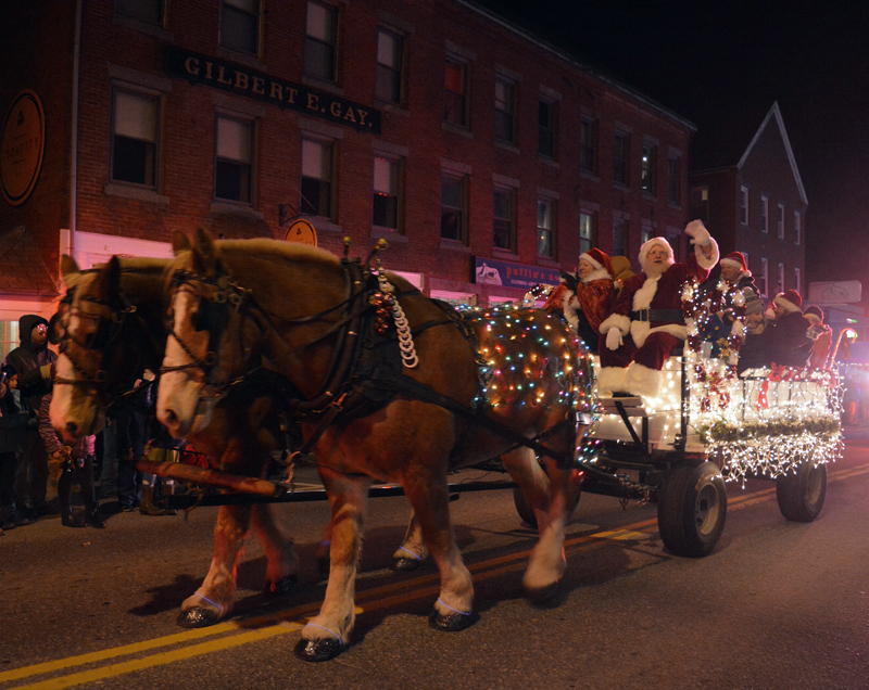 A team of horses pulls Santa Claus through downtown Damariscotta during the Parade of Lights in 2019. The popular parade returns to the Twin Villages on Nov. 26. (LCN file photo)