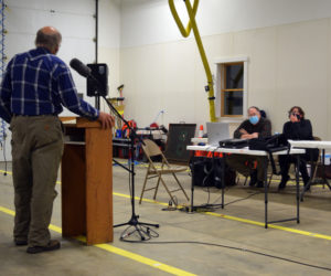 Alna resident Fred Bowers expresses his opposition to Article 4 before petitioners Katie Papagiannis and Tom Aldrich at a public hearing on Nov. 15. (Nate Poole photo, LCN file photo)