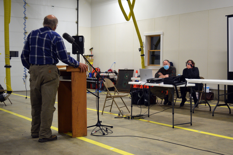 Alna resident Fred Bowers expresses his opposition to Article 4 before petitioners Katie Papagiannis and Tom Aldrich at a public hearing on Nov. 15. (Nate Poole photo, LCN file photo)
