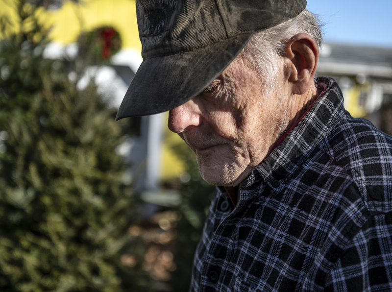 Linwood Palmer works the tree yard at his property in Nobleboro on Dec. 7. Palmer has been involved in the local Christmas tree business for more than 60 years. (Bisi Cameron Yee photo)