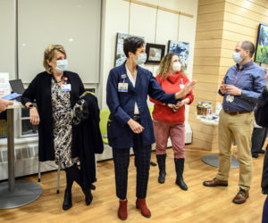 Cindy Wade, third from left, president of LincolnHealth, observes as department heads and staff share their excitement about the success of a job fair at the Central Lincoln County YMCA in Damariscotta on Nov. 16. (Bisi Cameron Yee photo)