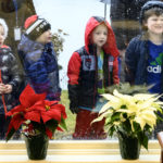 Singin’ in the Rain: JVS Carolers Undeterred By Damp Day
