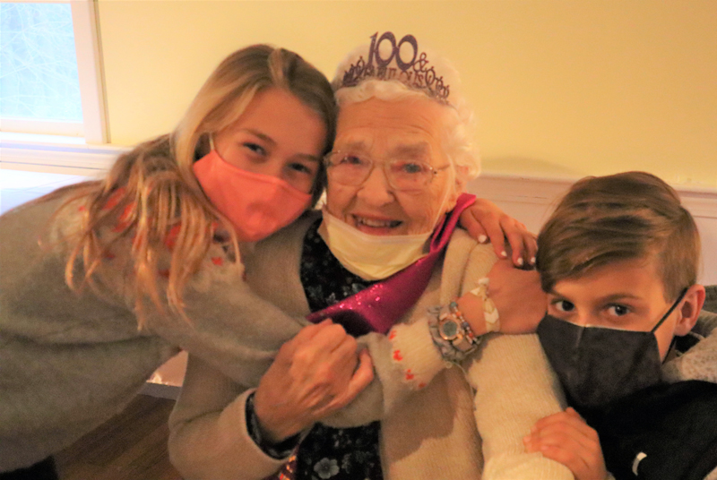 Eleanor Smith embraces great-grandchildren Lauren and Daniel Bresven during her 100th birthday on Dec. 18. (Emily Hayes photo)