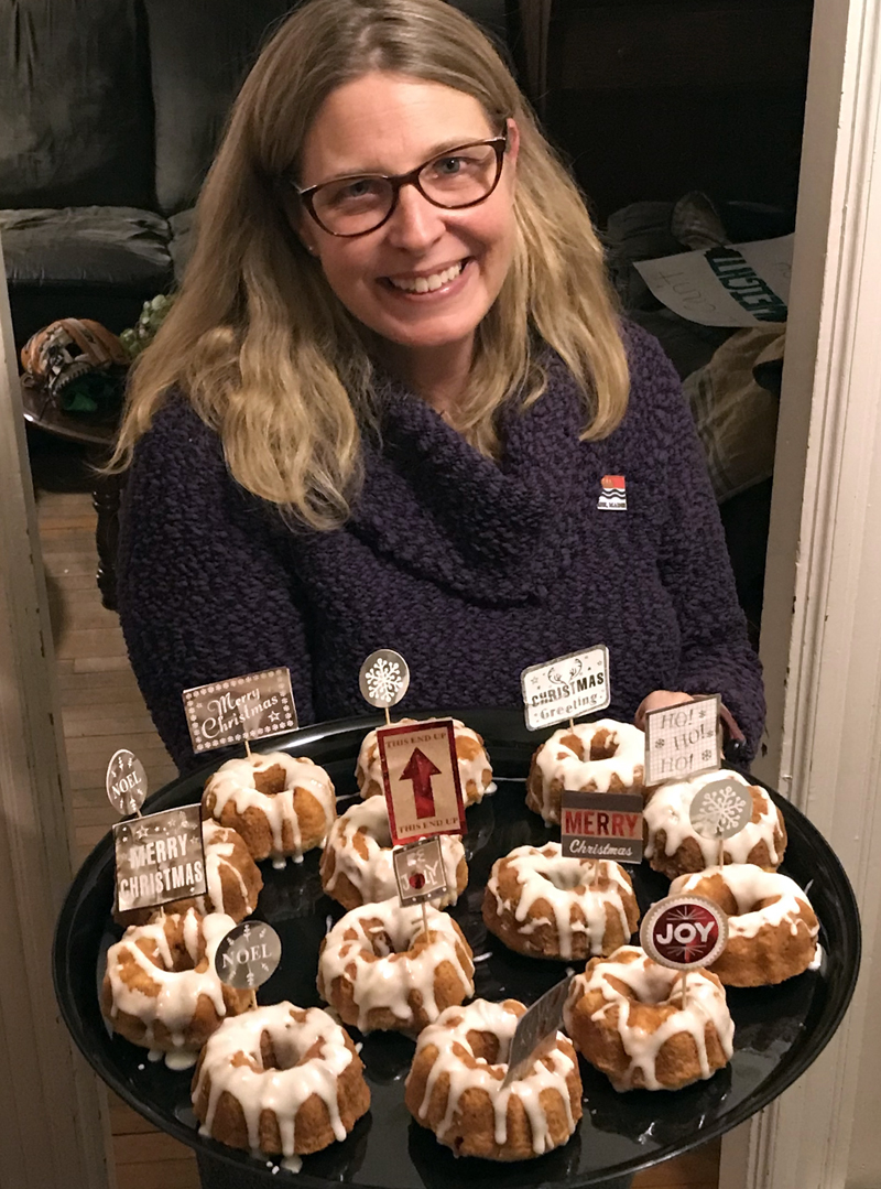 The author holds a tray of tiny cakes for an upcoming cookie walk. (Raye S. Leonard photo)