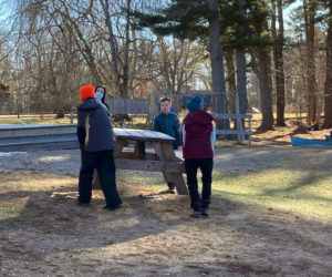Damariscotta Montessori School middle school students help out with campus chores. (Courtesy photo)
