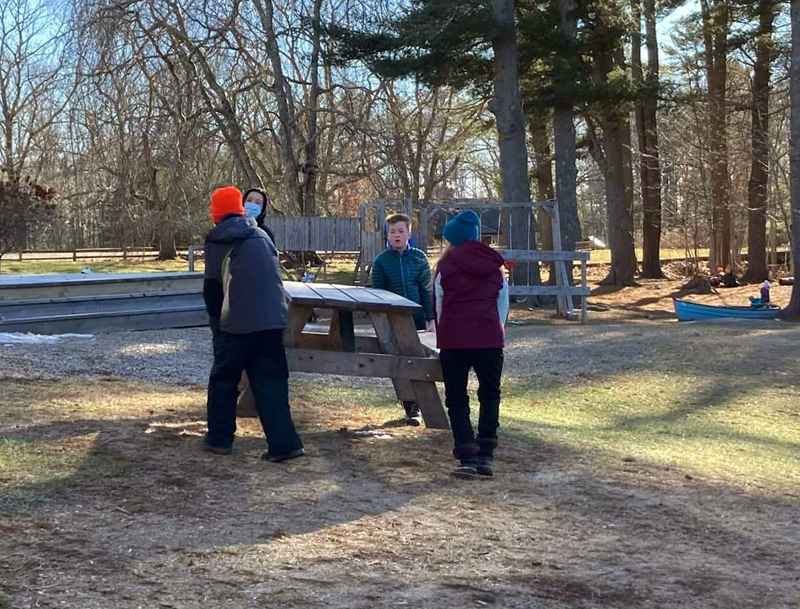 Damariscotta Montessori School middle school students help out with campus chores. (Courtesy photo)