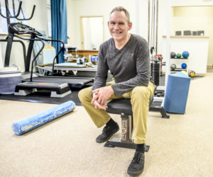 Glen Flaming poses for a picture at his new physical therapy office in Damariscotta. (Bisi Cameron Yee photo)