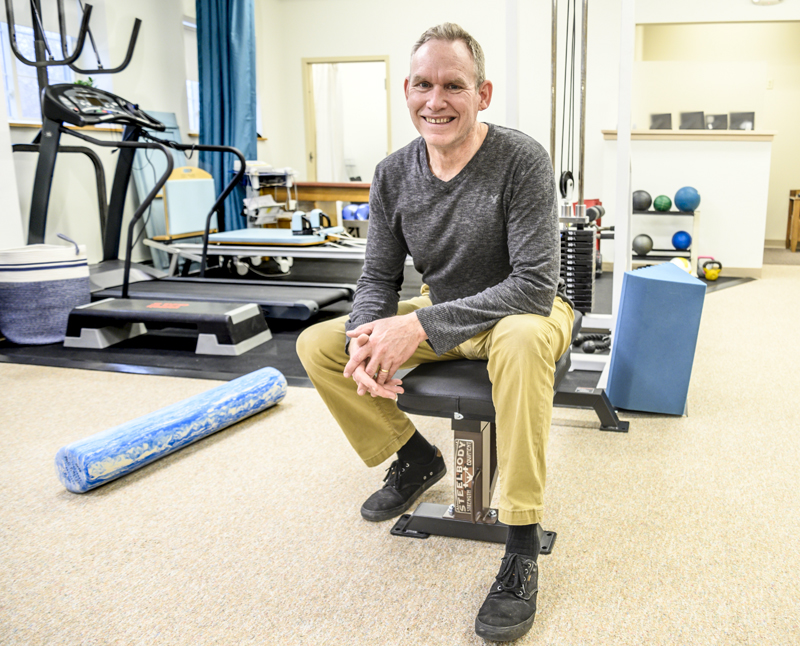Glenn Flaming poses for a picture at his new physical therapy office in Damariscotta. (Bisi Cameron Yee photo)