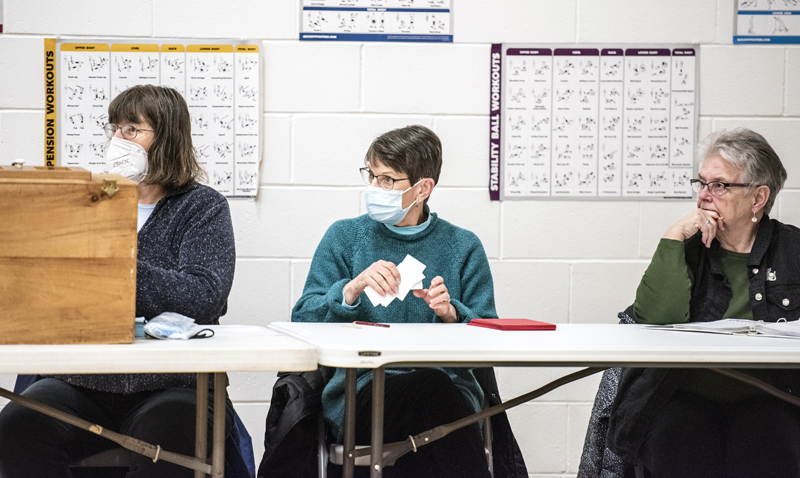 Poll workers Cheryle Fasano, Elizabeth Grimard, and Brenda Williams observe a special town meeting in Jefferson on Jan. 14. Jefferson residents voted to maintain their current ambulance service with Waldoboro EMS despite increased costs. (Bisi Cameron Yee photo)
