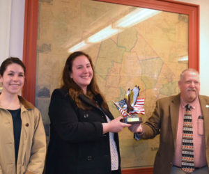Sheriff Todd Brackett, right, presents the 2020 Maine Sheriffs' Association Community Service Award to Healthy Lincoln County for their work during the pandemic in 2020 at the Lincoln County Commissioners meeting on Jan. 18. Left to right, Director of Healthy Lincoln County Kersey Robinson, Substance Use Prevention Project Coordinator Larissa Hannan. (Charlotte Boynton photo)