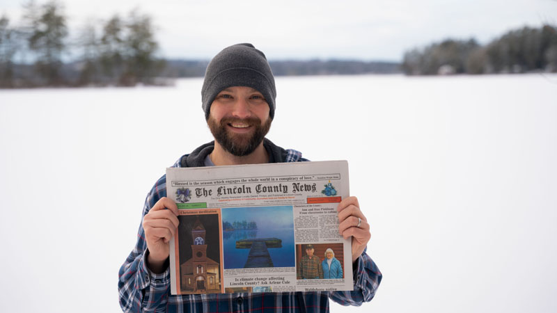 Andrew Duffy holds a copy of the Dec. 23 edition of The Lincoln County News featuring his photo at Damariscotta Lake. Duffy won the December contest before going on to win the annual contest. (Photo courtesy Andrew Duffy)