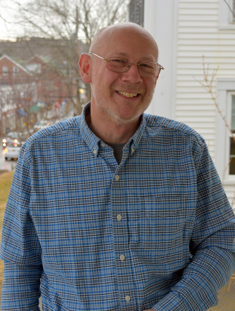 David Levesque, of Newcastle, stands on the porch of his office at 242 Main St. He is one of three candidates running for Maine Senate District 13 in 2022. (Nate Poole photo)