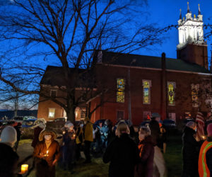 A large group of Lincoln County residents gathered at the Veterans Park in Newcastle on the evening of Jan. 6 to hold a vigil on the anniversary of last year's U.S. Capitol attack. (Nate Poole photo)