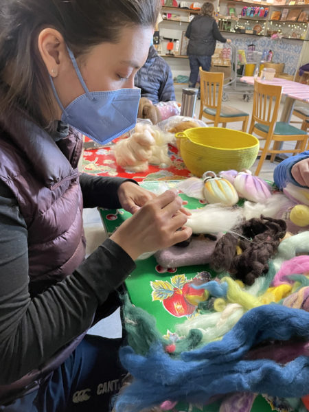 Isabel Stearns teaches participants how to make a needle felted fairy at Sheepscot General Store on Jan. 9. (Raye S. Leonard photo)
