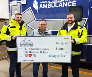 Colby & Gale Inc. General Manager Rob Wilkes (center) presents a donation for Central Lincoln County Ambulance Service to Service Chief Nicholas Bryant (right) and EMT Kobe Lincoln at its station in Damariscotta. (Courtesy photo)