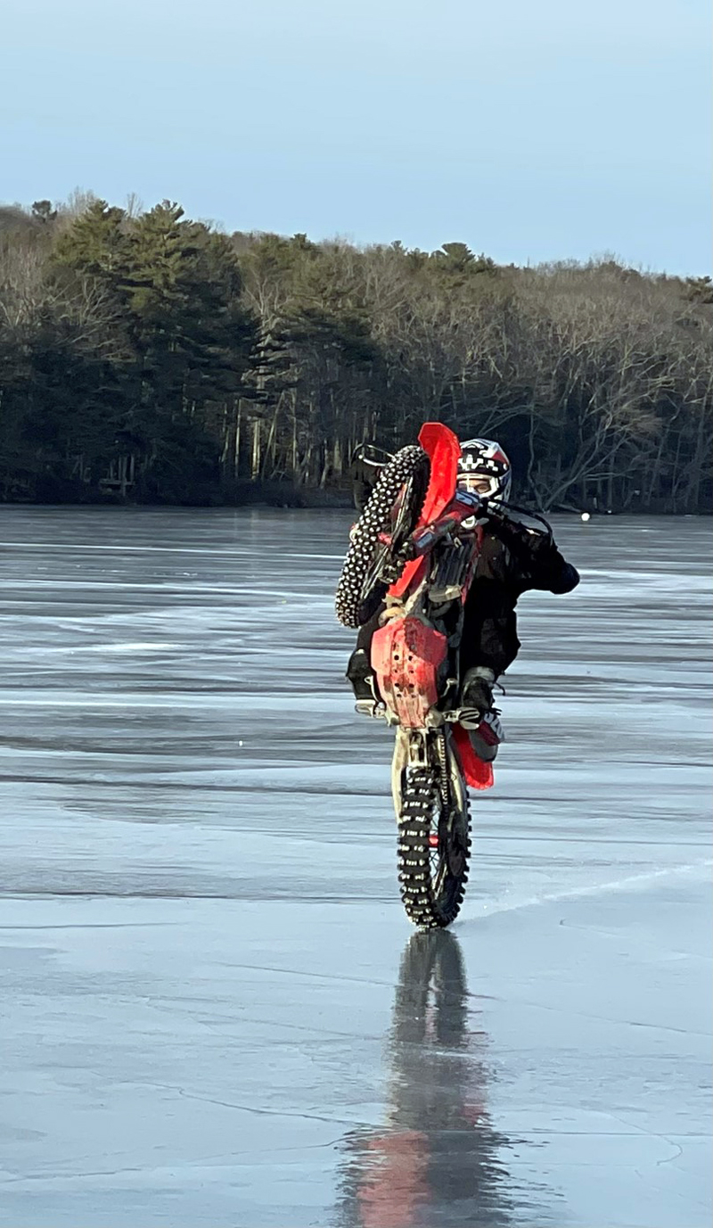 On a bright beautiful Sunday afternoon, local teen Alex Gutierrez was seen popping a wheelie as he rode his dirt bike down Biscay Pond. (Photo courtesy Matthew Hanly)