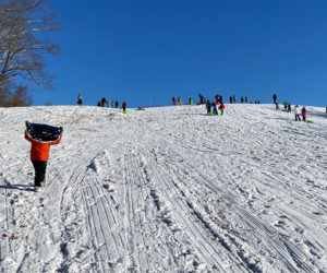 Sledding action on the big hill at Salt Bay Farm during Coastal Rivers sledding party on Jan. 8. (Courtesy photo)