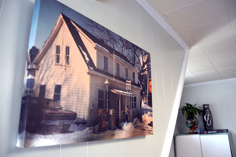 A print of the building that now houses Deb's Bristol Diner hangs in the restaurant. The photos is from 1971, and owner Debbie Thibault is looking for more information about the building's history. (Maia Zewert photo)