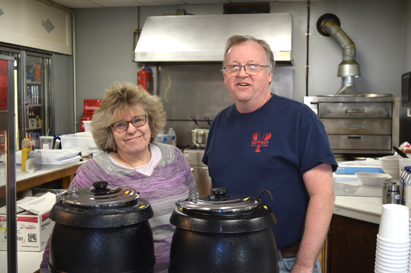 Lisa and Kent Boucher working at their new business, Harbor Light Convenience, on Jan. 26. (Nate Poole photo)