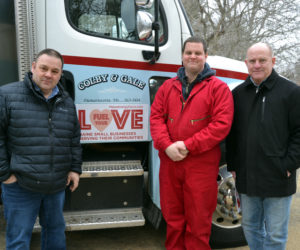 From left: Colby & Gale Inc. General Manager Rob Wilkes, delivery driver Nick Greenleaf, and Marketing Manager Michael Schroeder stand in front of a Colby & Gale truck with the Fuel Your Love logo. This is the companys 7th year participating in the event. (Maia Zewert photo)