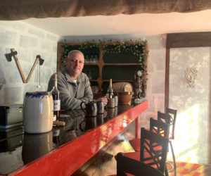 Painter and mead-maker Sean Bailey stands behind the bar he built in 2019 in his in-house tasting room. (Anna M. Drzewiecki photo)