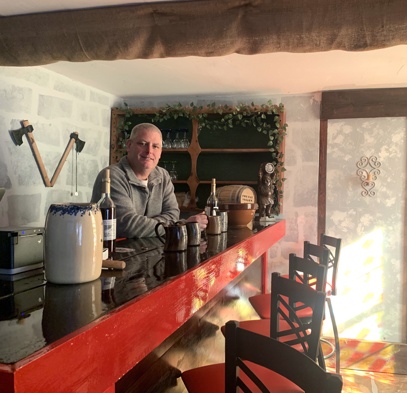 Painter and mead-maker Sean Bailey stands behind the bar he built in 2019 in his in-house tasting room. (Anna M. Drzewiecki photo)