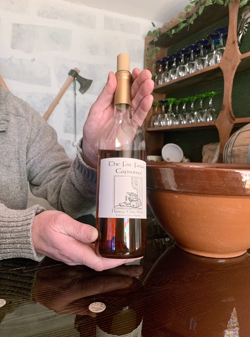 Sean Bailey holds a bottle of one of his six kinds of mead. Two more flavors are on the way. (Anna M. Drzewiecki photo)