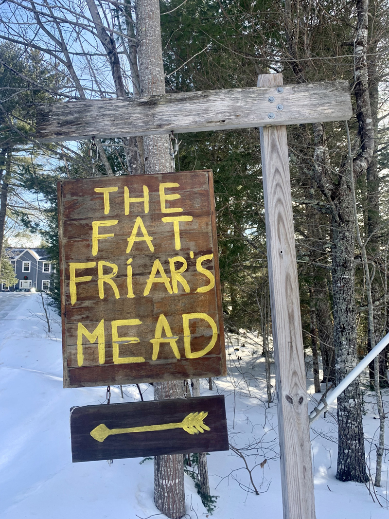 A hand-painted sign points towards the mead-making hive off Route 215 in Newcastle. (Anna M. Drzewiecki photo)