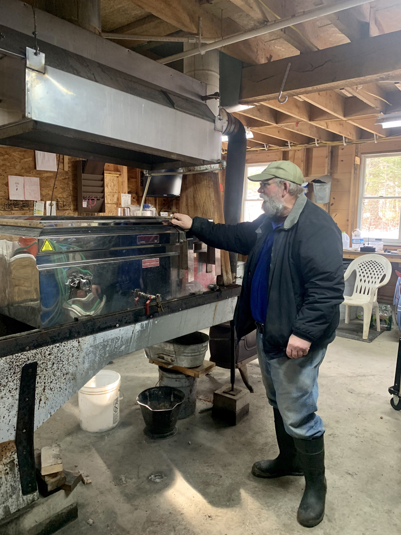 John Lee, owner of BlackOwl Maple Products, stands next to the boiler in his sugar house. He is not boiling sap this year. (Anna M. Drzewiecki photo)