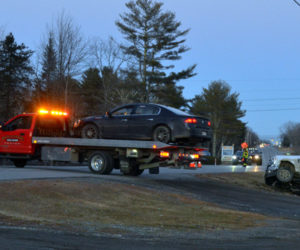 Hillside Collision Center removes a vehicle from the scene of a three-vehicle crash on Route 1 in Waldoboro the evening of Feb. 24. (Maia Zewert photo)