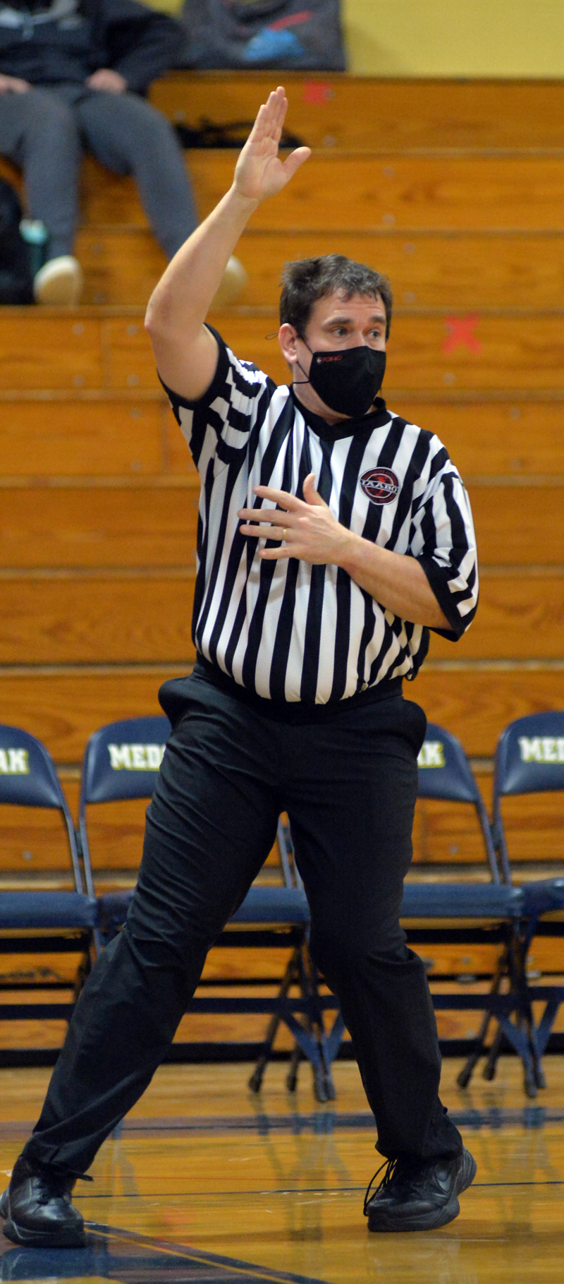 Basketball official Eddie Crocker makes a call. (Paula Roberts photo)