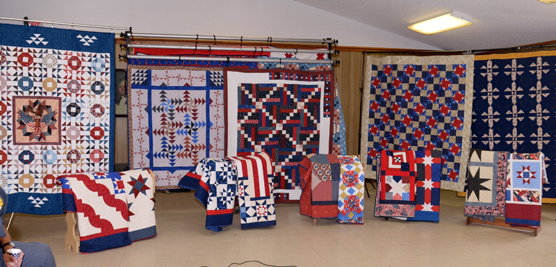 A display of patriotic quilts at Lincoln County Quilters 2010 Quilts of Gratitude program. Lincoln County Quilters have made over 200 quilts and presented them to combat veterans since 2015. The organization disbanded this week. (LCN file)