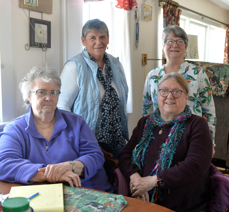 Lincoln County Quilters disbanded on Feb. 11. The group made over 200 quilts and presented to combat veterans since 2010. Pictured are club members Marge Bailey, president Sheila Rancourt, Karen Zuchowski (front right), and Peggy Jones. (Paula Roberts photo)