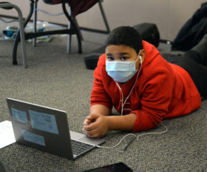 Kamarion Bragdon works on school work on his computer at the Wiscasset Community Center. (Paula Roberts photo)