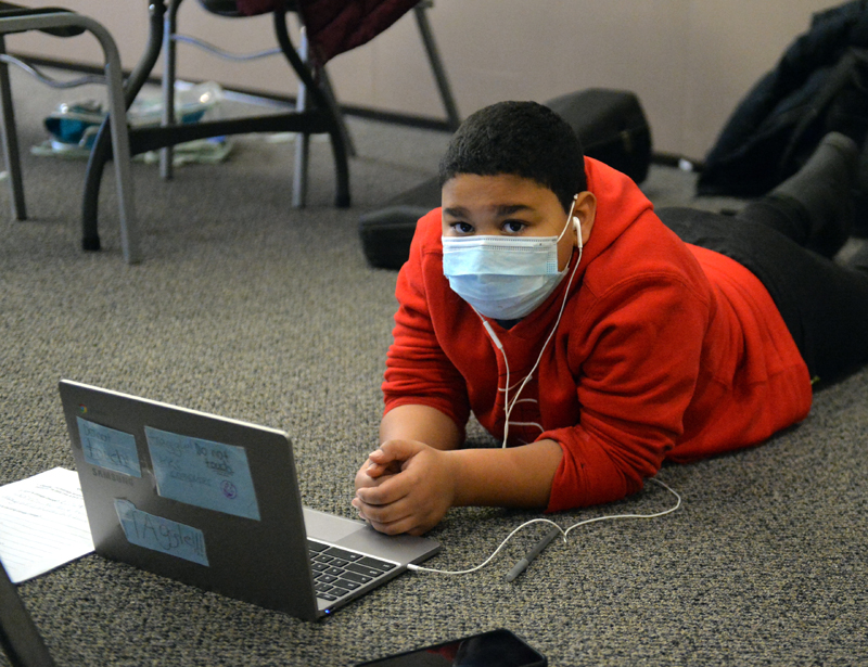 Kamarion Bragdon works on school work on his computer at the Wiscasset Community Center. (Paula Roberts photo)