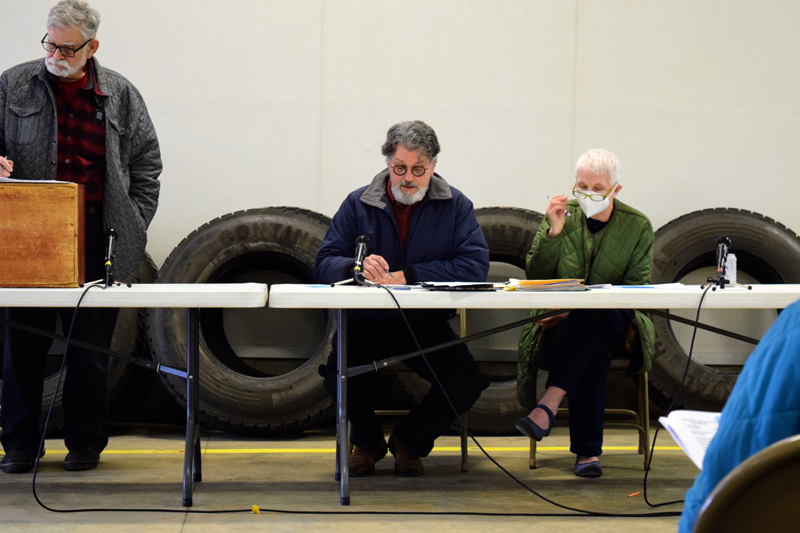 (From left) Moderator Jim Lothridge reads the town meeting warrant as First Selectman Ed Pentaleri reads a statement to Alna voters next to Second Selectman Linda Kristan on March 26. (Nate Poole photo)
