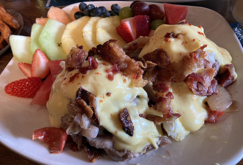 The prime rib eggs Benedict special at King Eider's Pub on Feb. 27. Two potato pancakes topped with prime rib, peppers, onion, American cheese, poached eggs, hollandaise sauce, and bacon. (Maia Zewert photo)