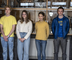 From left: Jonas Stepanauskas, Michal Maciejewicu, Flora Angyal, Audrey Hufnagel, Will Sherrill, and Marina McManus stand for a photo at Lincoln Academy in Newcastle on March 4. The six students helped focus attention on the plight of Ukraine by ringing the Lincoln Academy bell in recognition of those affected by the conflict and by sharing information on Ukraine during a school assembly. (Bisi Cameron Yee photo)