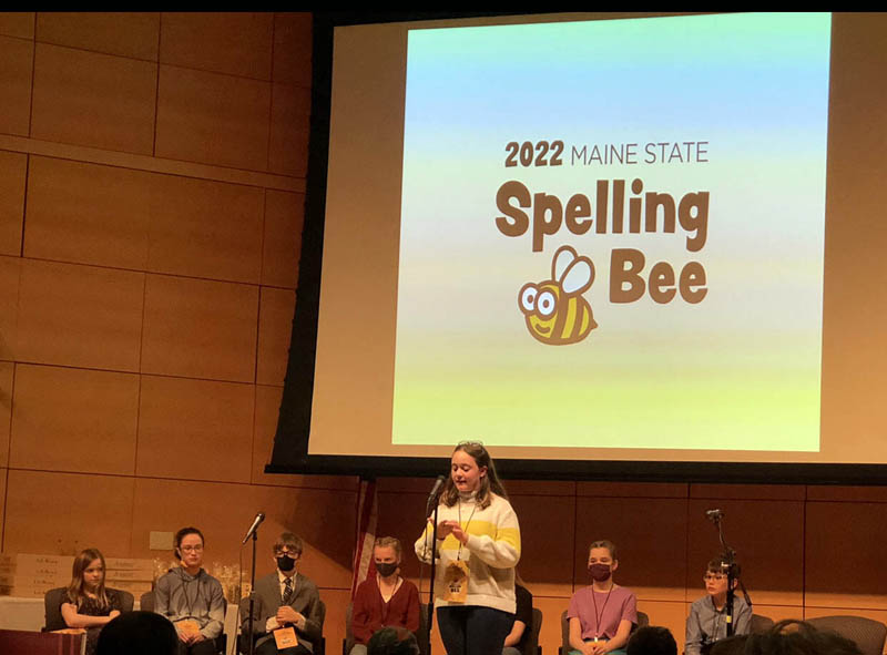 Amelia Rice spells a word on her hand at the Maine State Spelling Bee on March 26. (Photo courtesy Susan Bartlett Rice)