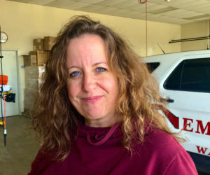 Karen-Ann Hagar-Smith stands in the garage of the Waldoboro Town Hall, Feb. 23. She says, "This, the town hall, is the place in Waldoboro that makes me the happiest. It's my refuge, my place of safety. It's where I feel loved and supported with every crazy, sad, challenging or fun day." (Photo courtesy Rebecca Cooney)