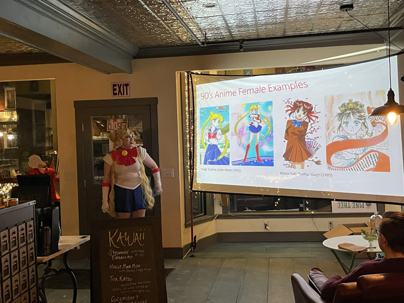 Drea Bloomer, dressed as Sailor Moon, talks about anime at Cupacity After Hours on Feb. 5. (Raye S. Leonard photo)