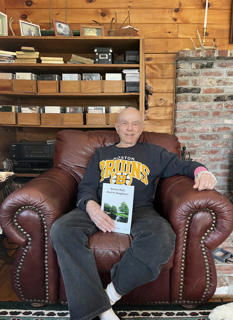 Pete Hope with his latest book, "Bristol Mills and its Neighbors" in his Pemaquid home. (Anna M. Drzewiecki photo)