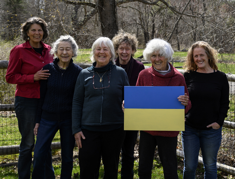 From left, Jane Herbert, Penny Moody, Marnie Sinclair, Sally Loughridge, Betty Heselton, and Lyn Asselta pose as a group with a board painted with the colors of the Ukrainian flag in Damariscotta on April 22. The six artists organized the Art for Ukraine sale to be held in Damariscotta on April 29 and 30. (Bisi Cameron Yee photo)