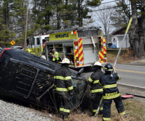 Newcastle firefighters work the scene of a rollover on Mills Road on April 12. The town and the Taniscot Engine Company have agreed on a fire and emergency protections ordinance to define the company's relationship to the town that will be discussed at a public hearing at 7 p.m. Monday, April 25 at Clayton V. Huntley Jr. Fire Station. (Evan Houk photo)