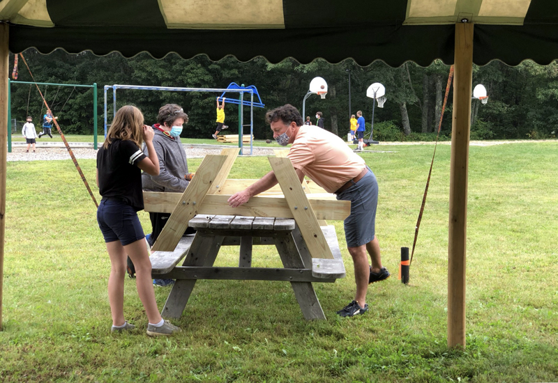 Former Principal Martin Mackey builds picnic tables with students in the Center for Alternative Learning at the Nobleboro Central School. (Photo courtesy NCS)