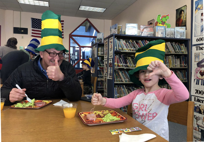 Former Principal Martin Mackey gives a thumbs up to green eggs and ham as he shares breakfast with kindergartners at the Nobleboro Central School. (Photo courtesy NCS)