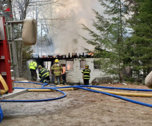 Somerville and other area fire departments work to extinguish a home fire at 776 Somerville Road the afternoon of April 21. (Alec Welch photo)